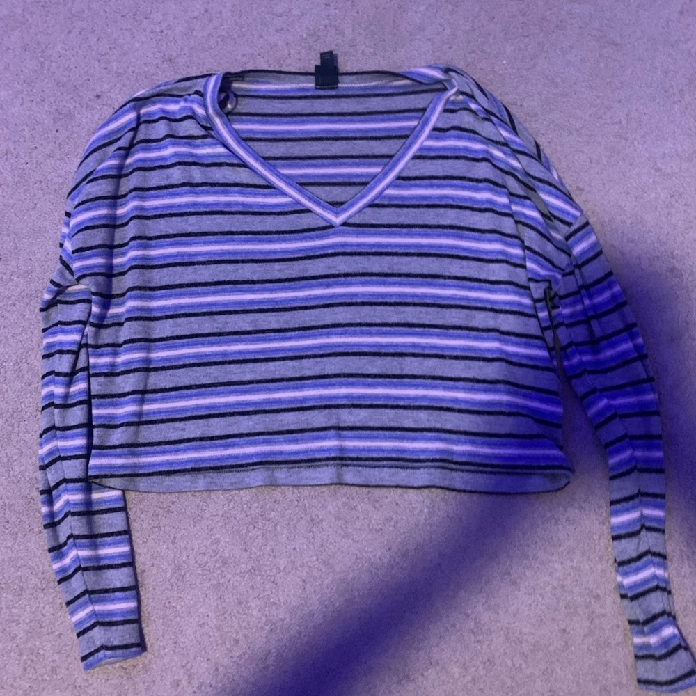 Pink blue and black striped long sleeve shirt. Base or shirt is gray.